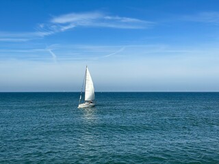 A lonely sailboat in the North Sea in the Hague