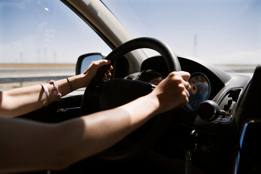 Fototapeta Close-up of a woman Driving through the desert, USA