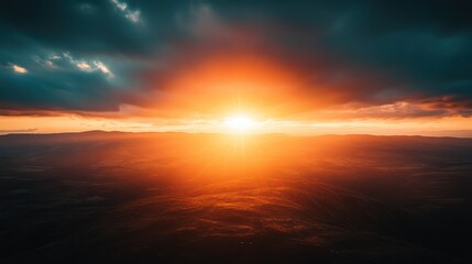 Obraz premium Majestic Sunset Over Rolling Hills: A Breathtaking Aerial View