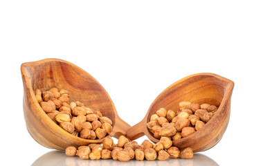 Several hazelnuts with wooden bowl, close-up, isolated on white background.