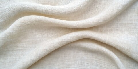 Soft white linen fabric displayed with gentle folds and texture