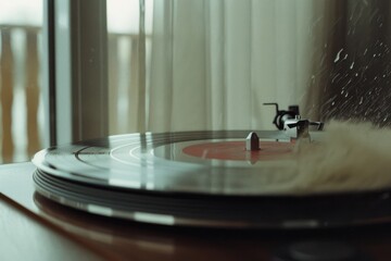 Fototapeta premium A spinning vinyl record on a turntable, softly backlit, exuding nostalgia and inviting listeners into an immersive musical experience.