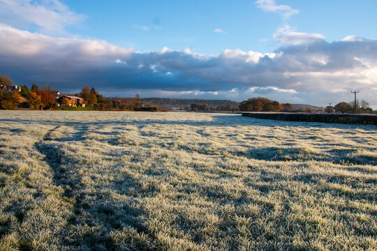 A view of a frost covered field on a cold winter monring