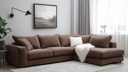 Fototapeta premium This modern living space showcases a large, comfortable brown corner sofa paired with a cozy throw, under soft natural light