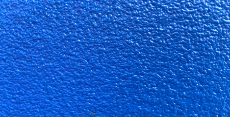 Blue wall texture background.The stone wall surface painted with enamel paint.