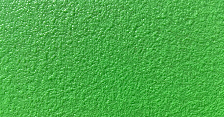 Green wall texture background.The stone wall surface painted with enamel paint.