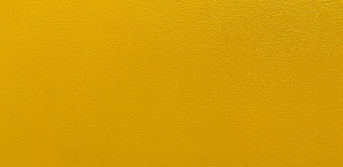 Yellow wall texture background.The stone wall surface painted with enamel paint.