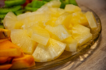 Exotic summer fruits of pineapple. Exotic vitamin salad. Tropical salad. Island food. Luxury fruit mix. Tropical food. Exotic fruit