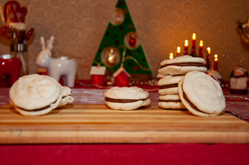 Macaron dessert for Christmas. French macaron. Macaroon cookie. Sweet French macaroon. Sweet tooth. Yummy Christmas. Homemade yummy cookie. Xmas eve with family at home. Sugary sweetness