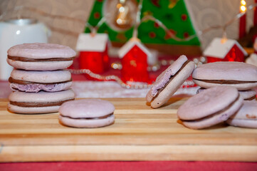 Homemade yummy cookie. Xmas eve with family at home. Macaron dessert for Christmas. French macaron. Macaroon cookie. Sweet French macaroon on board. Sweet tooth. Yummy Christmas