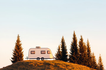 minimal fashionable caravan parked on hill surrounded by evergreen trees, showcasing serene outdoor setting. soft colors of sky enhance peaceful atmosphere