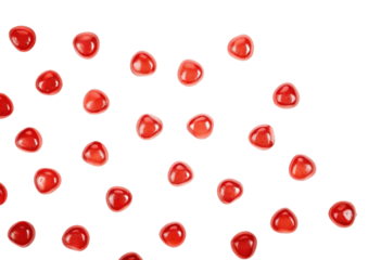 Pomegranate seeds scattered on a green background isolated with transparent background