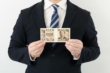 スーツ姿のビジネスマン お金