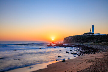 Fototapeta premium 秋の犬吠埼灯台と日本一早い日の出 千葉県銚子市 Autumn Inubosaki Lighthouse and the earliest sunrise in Japan. Chiba Pref, Choshi City.