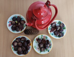 Shiny brown chestnuts on the table