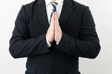 スーツ姿のビジネスマンポーズ 謝罪