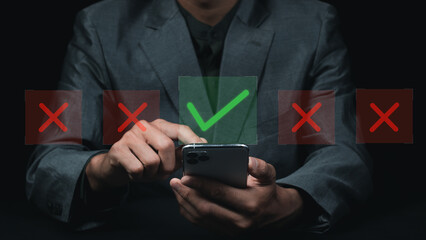Businessman hand showing right and wrong symbol The idea is to decide to vote. Think yes or no decisions, and business options for difficult situations. true and false symbols agreeing.