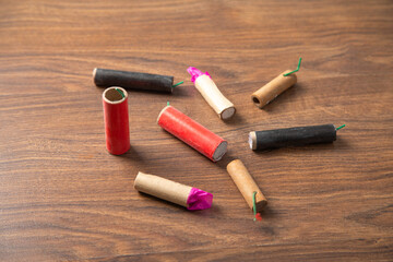 Firecrackers on the wooden background.