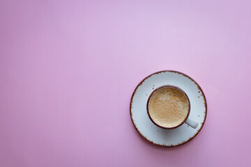 coffee cup with coffee beans on pastel background. flat lay, top view