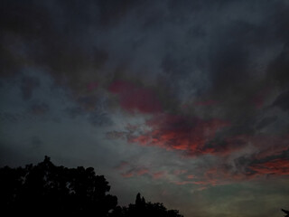 The sky is at sunset. Beautiful clouds on the background of sunset.Dramatic cloud in sunset scene...