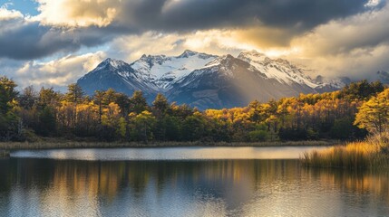 Naklejka premium Serene Autumn Lake with Majestic Snow-capped Mountains