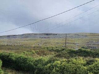 Power Lines in a Natural Highland Landscape with Clouds and Plants © Studio-M