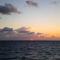 Fototapeta premium Scenic view of sea against sky during sunset