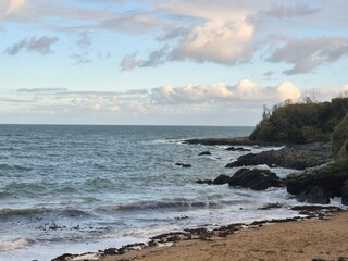 Morning Beach Landscape with Clouds and Water Reflection
