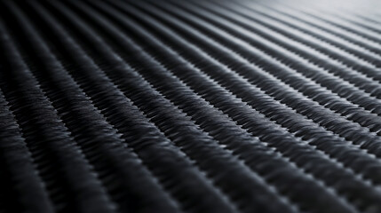 A close-up view of carbon fiber composite raw material.