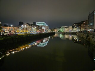 Urban Cityscape with Lake and Tower Blocks Under Sky