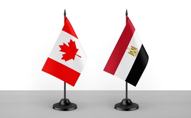 Image of the table flag of Canada and Egypt countries. White background. Close-up flags. High...