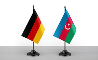 Image of the table flag of Germany and Azarbaijan countries. White background. Close-up flags. High...