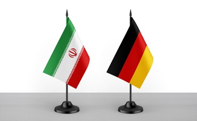 Image of the table flag of Iran and Germany countries. White background. Close-up flags. High...