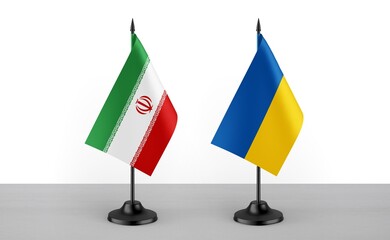 Image of the table flag of Iran and Ukraine countries. White background. Close-up flags. High...