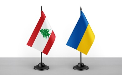 Image of the table flag of Lebanon and Ukraine countries. White background. Close-up flags. High...