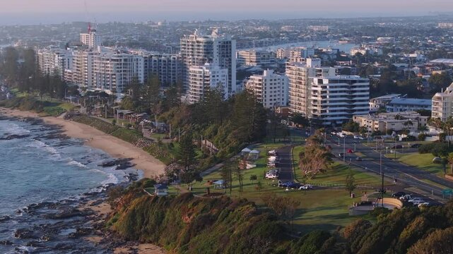 Sunshine Coast with greenery, busy road and skyline in the coastal Mooloolaba suburb at sunset