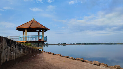 Serene lakeside gazebo and beautiful natural in Nam Houm lake, at Vientiane capital, Laos, Asia