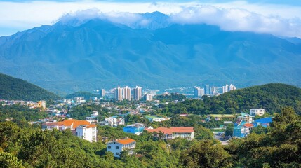 Vibrant Cityscape Nestled in Majestic Mountain Landscape