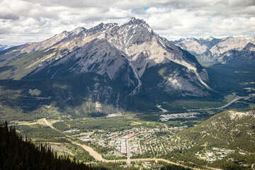A mountain range with a town in the valley below © Scott Prokop