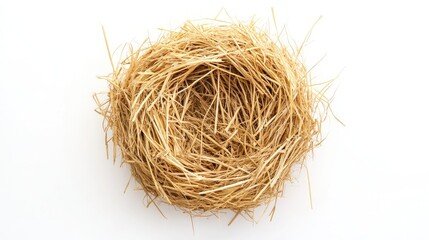 Natural straw nest top view on white background showcasing texture and organic elements for agricultural or rustic design concepts