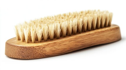Wooden shoe or clothes brush with soft bristles isolated on white background viewed from the side demonstrating craftsmanship and functionality