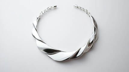 Elegant silver female necklace with twisted design showcased on a clean white background for jewelry advertising and promotional use.