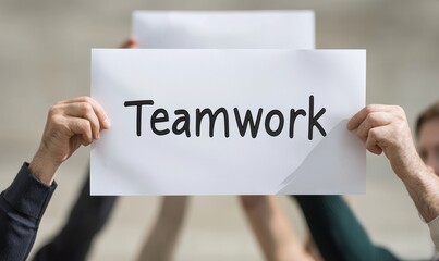 Teamwork in actiongroup holding sign in urban setting