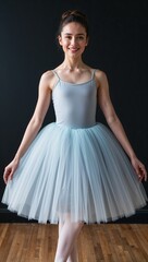 Fototapeta premium Tulle ballet inspired dress knee length black background 
