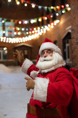 Portrait of Santa Claus in the dark with lights. 