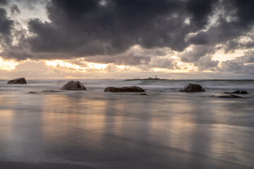 Obraz premium Stunning Sunset at the Coast – Long Exposure Capturing the Smooth Flow of Water and Vibrant Sky Colors, Creating a Peaceful and Serene Seaside Landscape Norway Norge - Jæren, jærstrendene