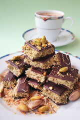 Sliced Dubai Chocolate stacked on plate and served with a cup of coffee