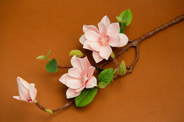 Pink lily flower. a bouquet of pink with leaves on the stem. for decorating tables, shops. artificial. Valentine's day background. Summer. Spring. top view. Love. Orchid.	