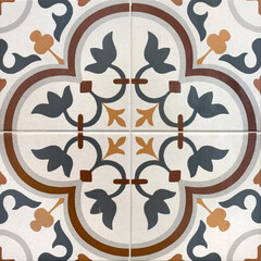 Close up of heritage or colonial tiles in in white green and grey floral curve pattern. Colonial...