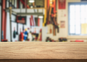 Beautiful natural wood tabletop and workshop or garage background with tools